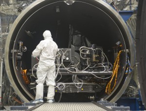 A technician surveys the TIRS instrument and the calibration equipment