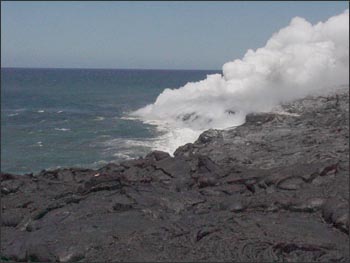 Steam from the Pu'u O'o eruption as lava enters the ocean, on the island of Hawai'i in May 2001.