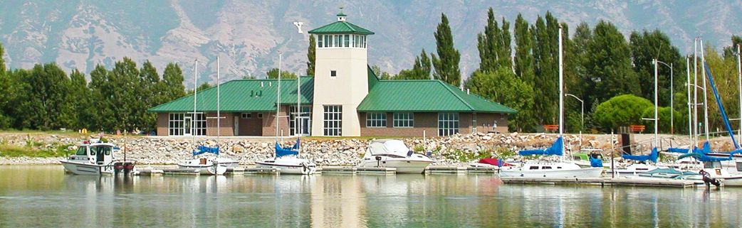 Sailboats in front of a Utah Lake visitor center