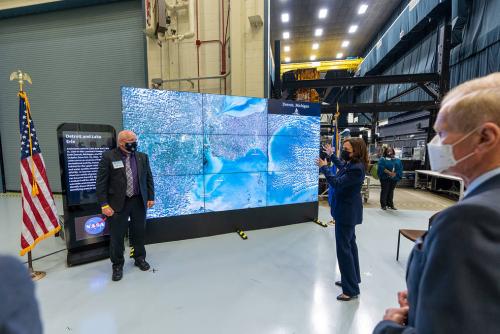 Vice President Kamala Harris shares her enthusiasm, alongside Goddard Center Director Dennis Andrucyk and NASA Administrator Bill Nelson, for the results of current satellite missions using Goddard's Hyperwall