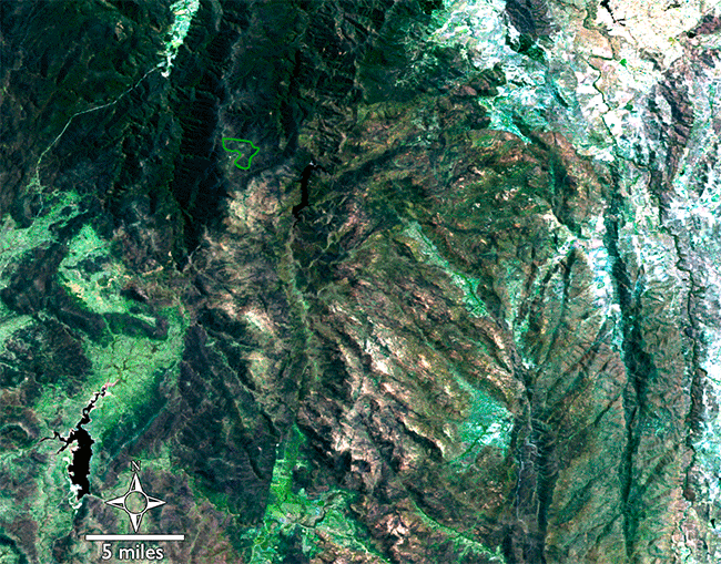 Ginini Flats Wetland Complex is a small Ramsar-recognized wetland in the Australian Alps. Twenty years ago, much of the bog was damaged. In these Landsat images, Ginini Flats Wetland Complex's location is shown with a green boundary line. A natural Landsat 8 image shows the largely recovered region on January 8, 2023. A natural color Landsat 7 image from January 25, 2003 shows the region under hazy conditions during the massive wildfires that occurred that year. Using the shortwave infrared, near infrared, and green bands from the same 2003 date, the massive expanse of burned lands can be seen in red and active fire fronts are bright orange. 