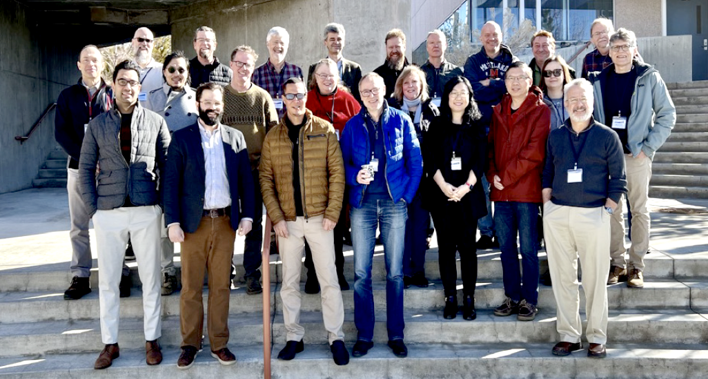 The 2018-2023 Landsat Science Team stands on the stairs of the Desert Research Institute in Reno.