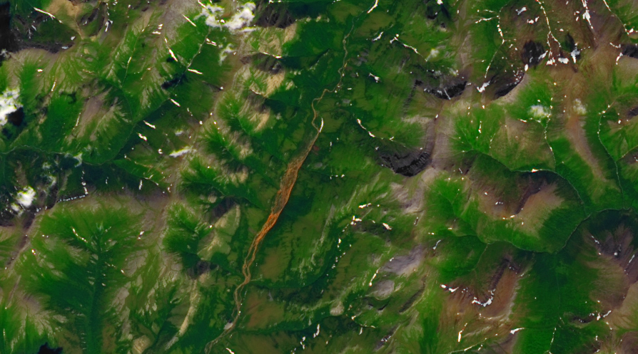 An iron-colored Tukpahlearik Creek running through northwest Alaska, adjacent to Kobuk Valley National Park and north of the Arctic Circle.