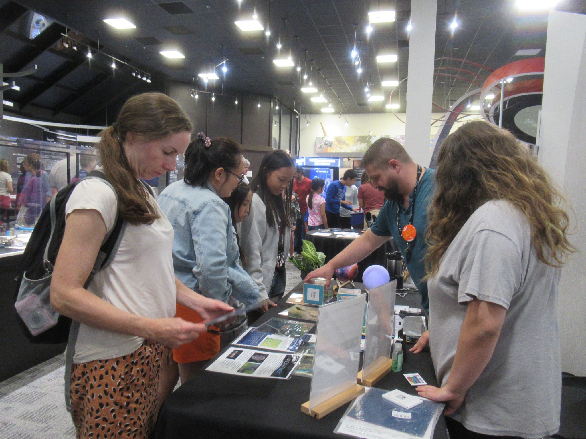 Landsat outreach specialist Michael Taylor at the Landsat booth at Goddard's International Observe the Moon night.