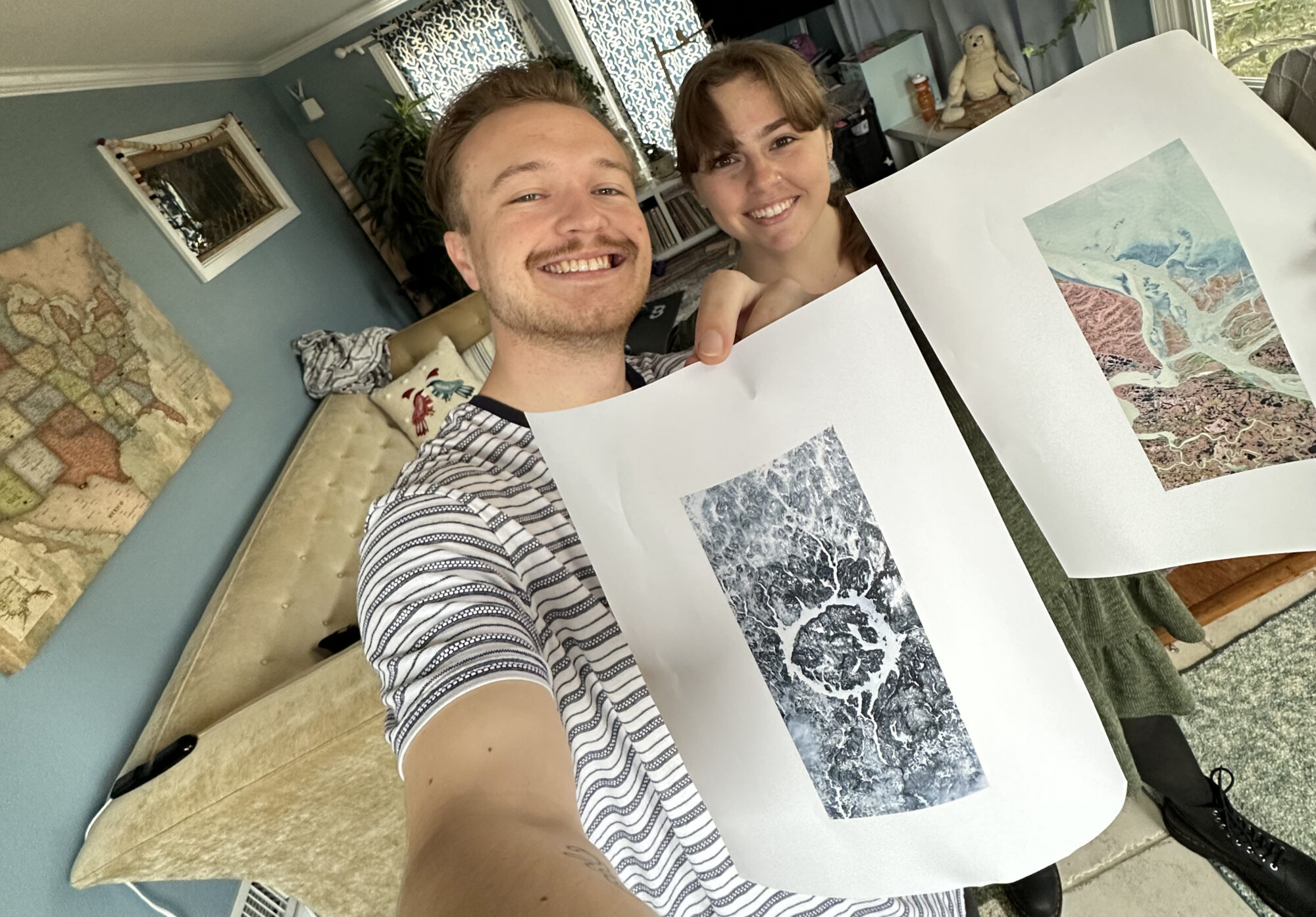 Ross Walter (left) holds a letter O and Ally (right) holds the letter A. Both letters were found in Landsat imagery.