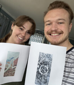 A smiling Ally (left) and Ross (right) hold up their favorite Landsat letters: A (Ally) and O (Ross).