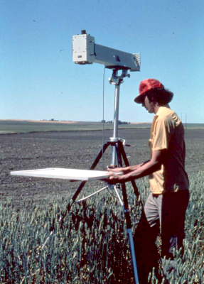 Taking a calibration panel measurement with an Exotech 100 in 1975 as part of the LACIE field campaign